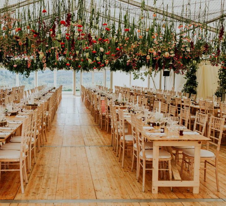 Scottish wedding with marquee decorated in hanging flowers