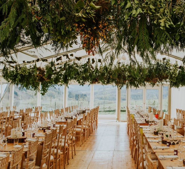 Scottish wedding with marquee decorated in hanging flowers