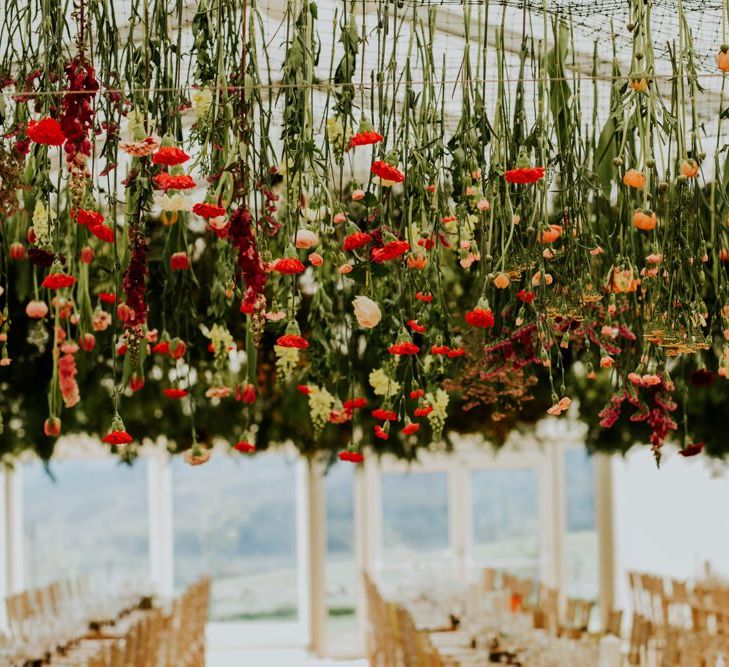 Scottish wedding with marquee decorated in hanging flowers