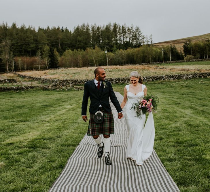 Scottish wedding with marquee decorated in hanging flowers