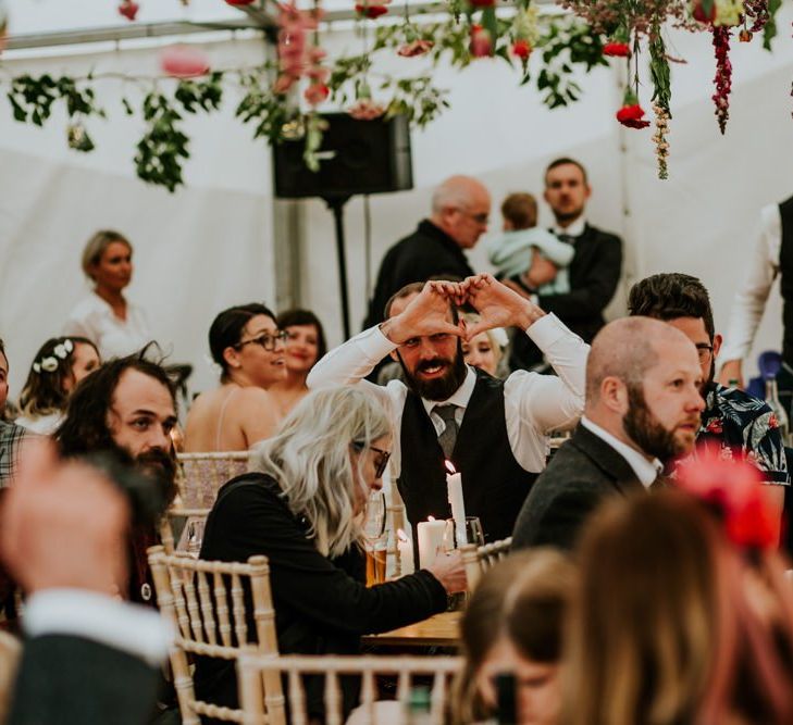 Bride and groom enjoy the wedding speeches