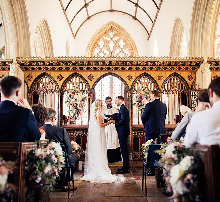 Church wedding ceremony with bride and groom exchanging vows