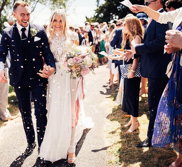 Confetti moment with bride in Julio Vino wedding dress