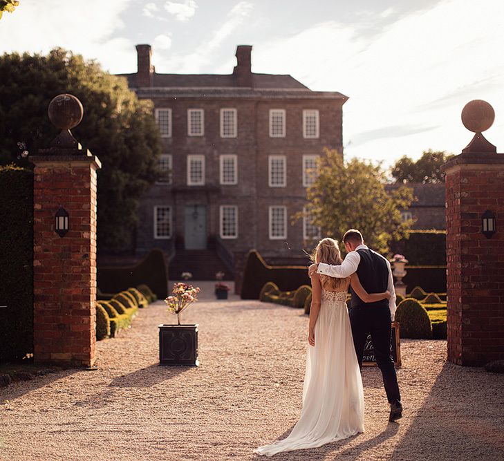 Bride and groom portrait outside their Kingston Estate wedding venue