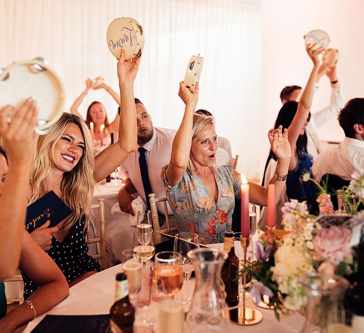 Wedding guests shaking their Tamborine wedding favours