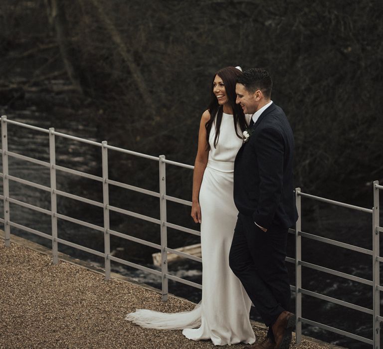 Bride in Fitted Charlie Brear Wedding Dress and Groom in  Next Suit