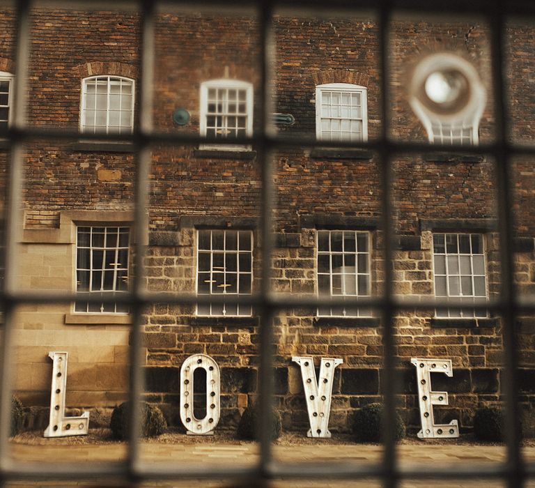 Giant LOVE Letters Outside Industrial Wedding Venue The West Mill