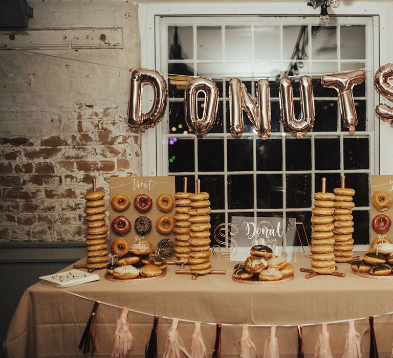 Doughnut Cake Station with Towers, Walls and Gold Foil Balloon Sign