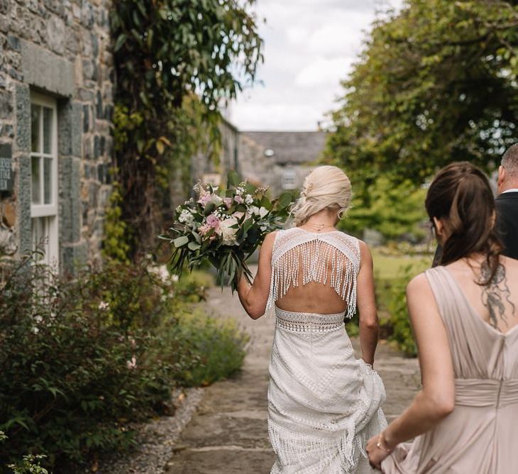 Bride makes her way to ceremony at Irish wedding venue