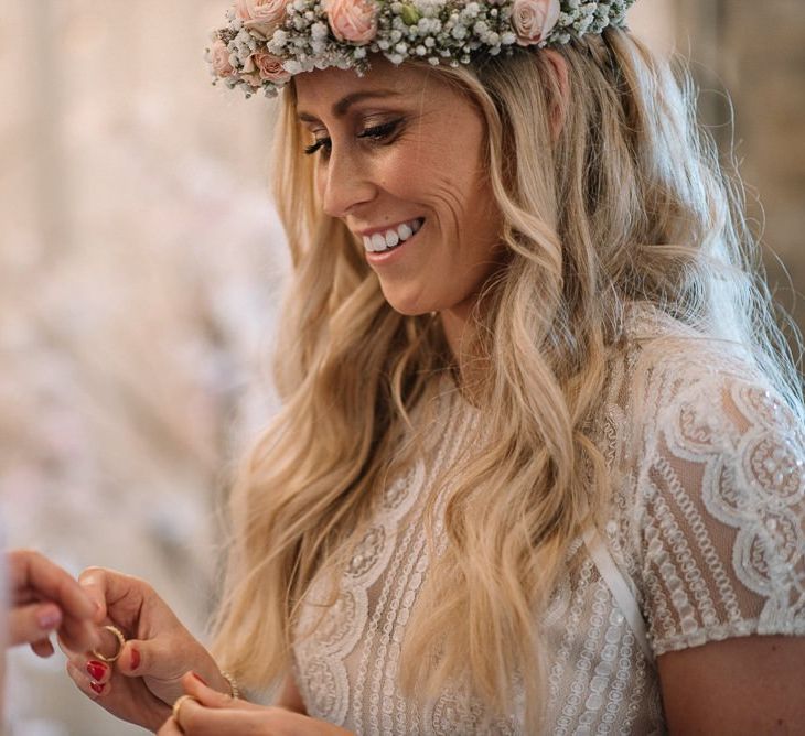 Bride wears pink flower crown at same-sex wedding