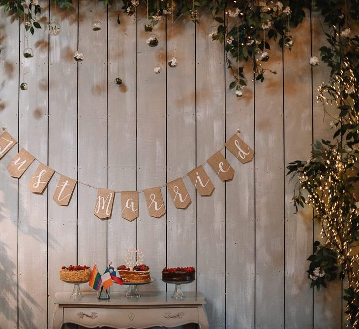 Wedding cake table with just married bunting