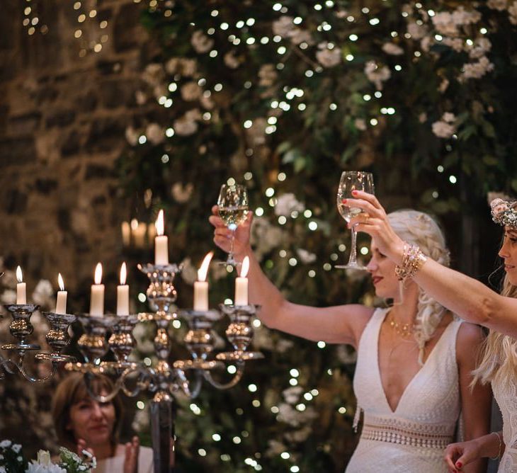 Brides toast the wedding speeches at Ballymagarvey Village in Ireland