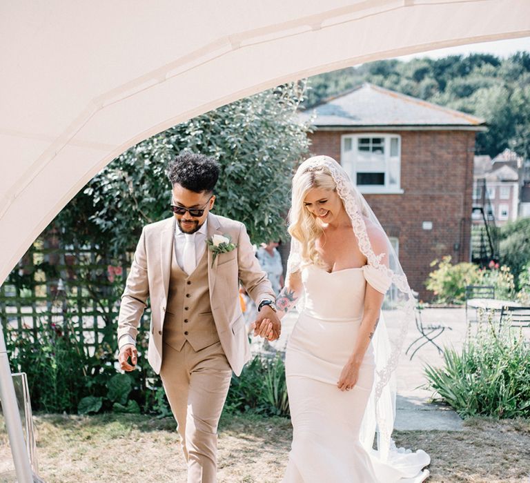 Real Bride in Pronovias Raciela Wedding Dress  and Groom in Bright Three Piece Moss Bros. Suit