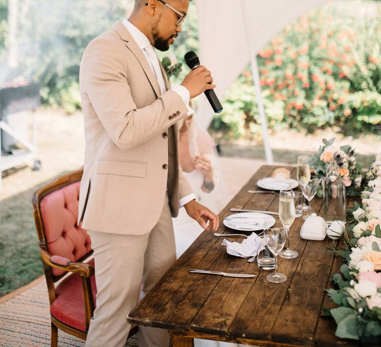 Groom Giving His Wedding Speech under a Stretch Tent with Festoon Lights