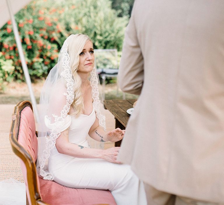 Emotional Bride in Fitted Pronovias Wedding Dress Crying During the Wedding Speech From her Husband