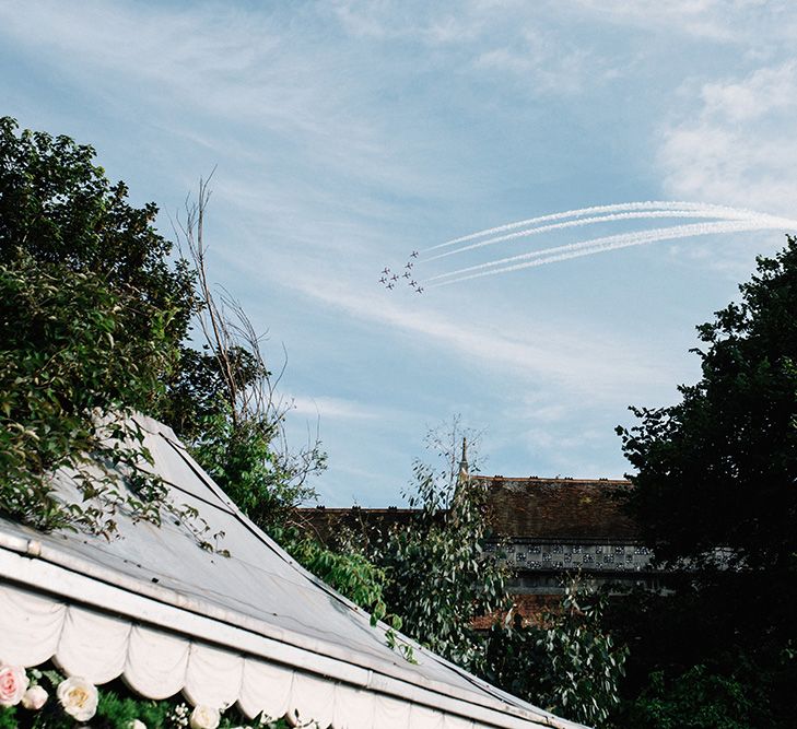 Red Arrow Fly Over During Wedding Reception