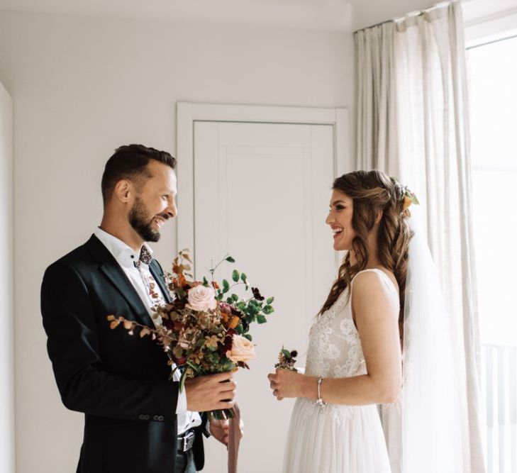 First Look with Bride in Fay Katya Katya Wedding Dress and Groom in Black Suit