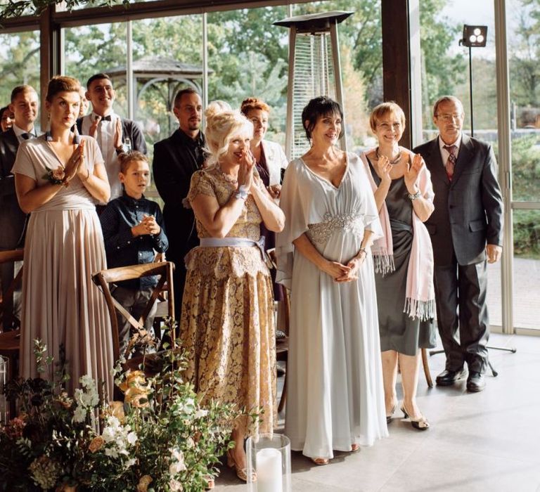 Stylish Wedding Guests Clapping During the Wedding Ceremony