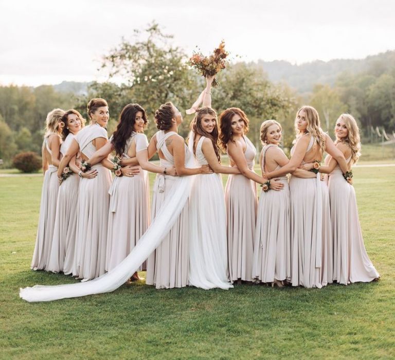 Bridal Party Portrait with Bridesmaids in Oyster Multiway Dresses and Bride in Fay Katya Katya Wedding Dress