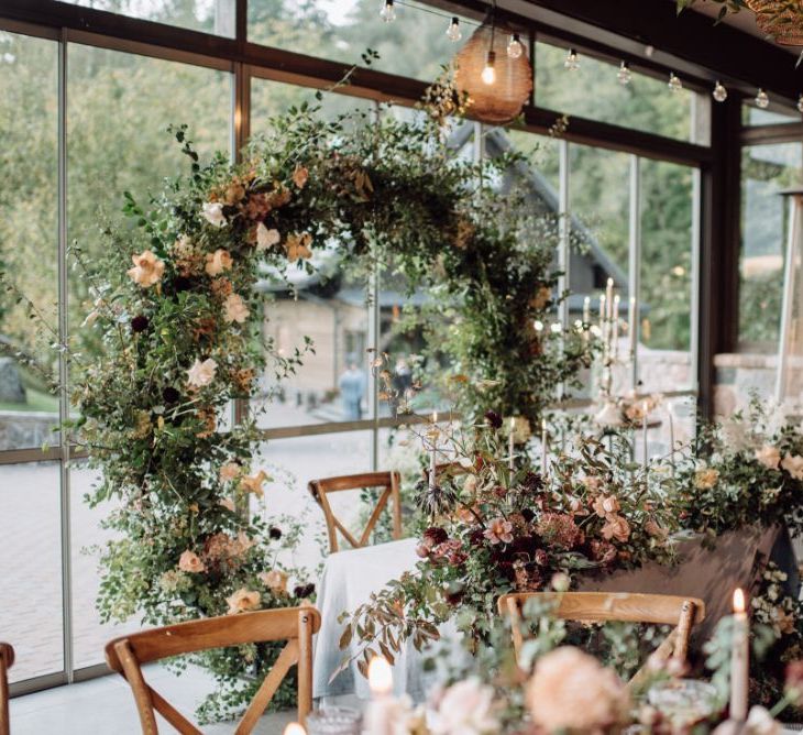 Top Table Wedding Flowers with Moon Gate Backdrop and Floral Table Runner