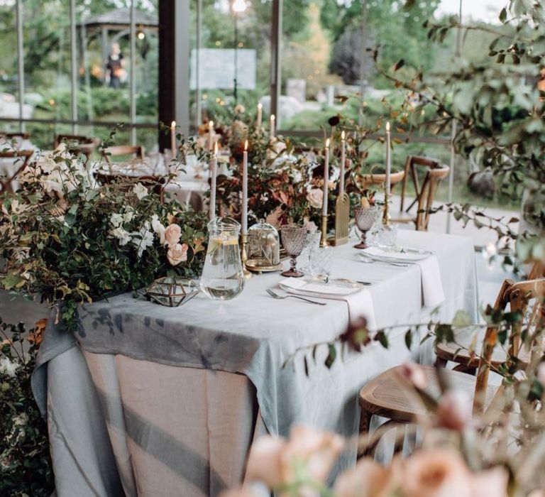 Flower Filled Sweetheart Table with Candles