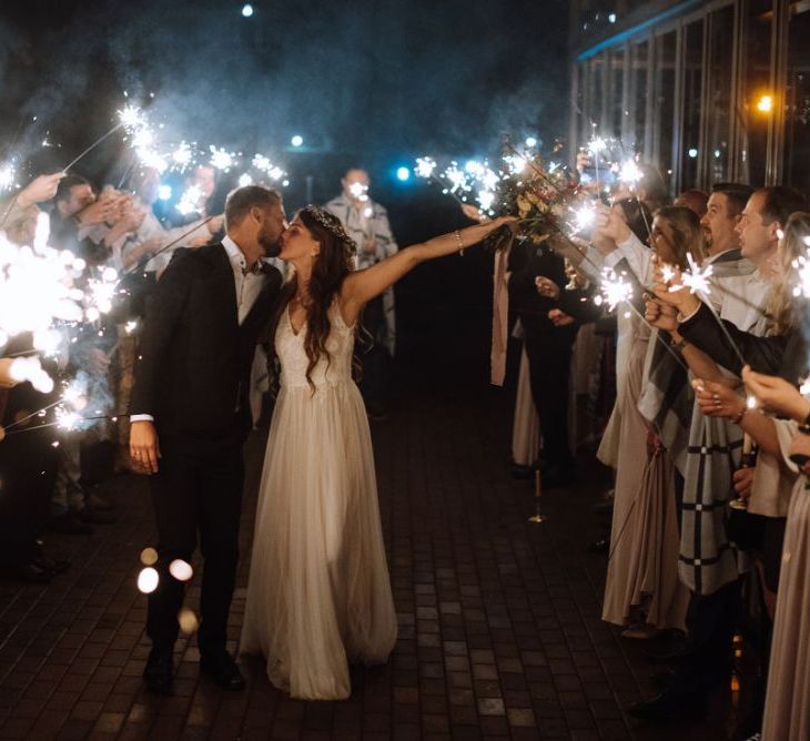 Sparkler Moment with Bride in Fay Katya Katya Wedding Dress and Groom in Black Suit Kissing