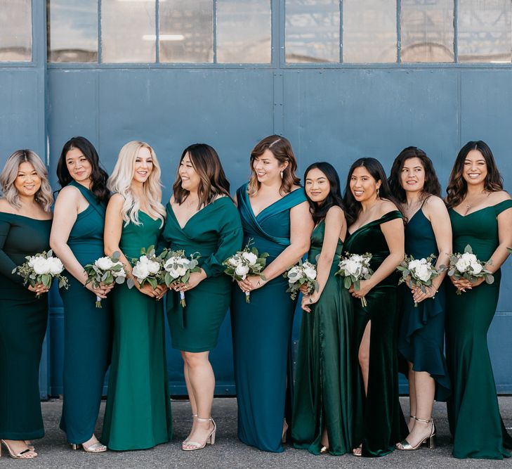 Bridesmaids in different green dresses