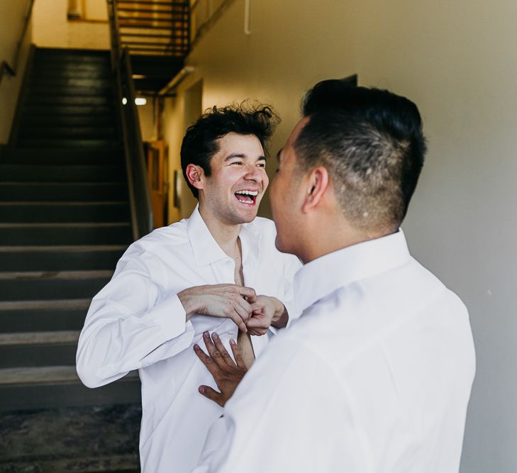 Groom and groom getting ready together on the wedding morning