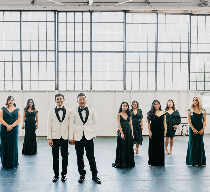 Groom and groom with heir bridesmaids in forest green dresses