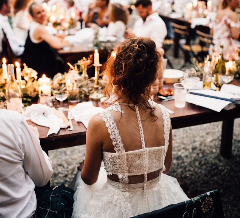 Bride with curly hair in Yolan Cris wedding dress