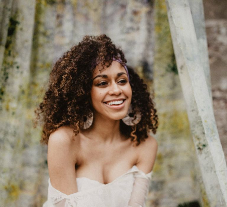 bride with retro 70s curly wedding hair in a scarf