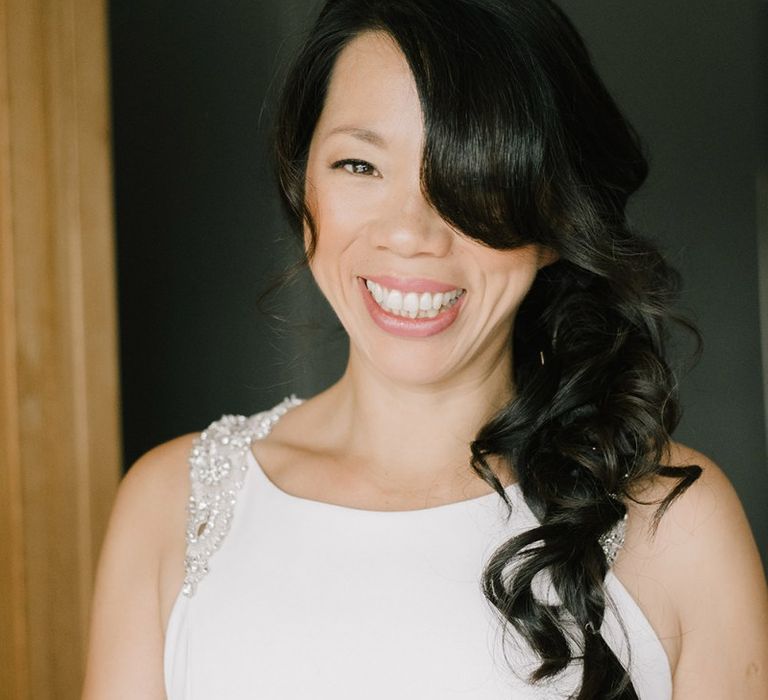 Bride on wedding morning with side swept long hair