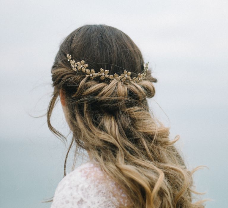 Half up half down wedding hair with rolled pinned detail