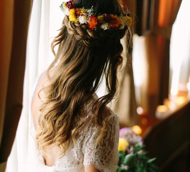 Braided half up half down wedding hair with flowers