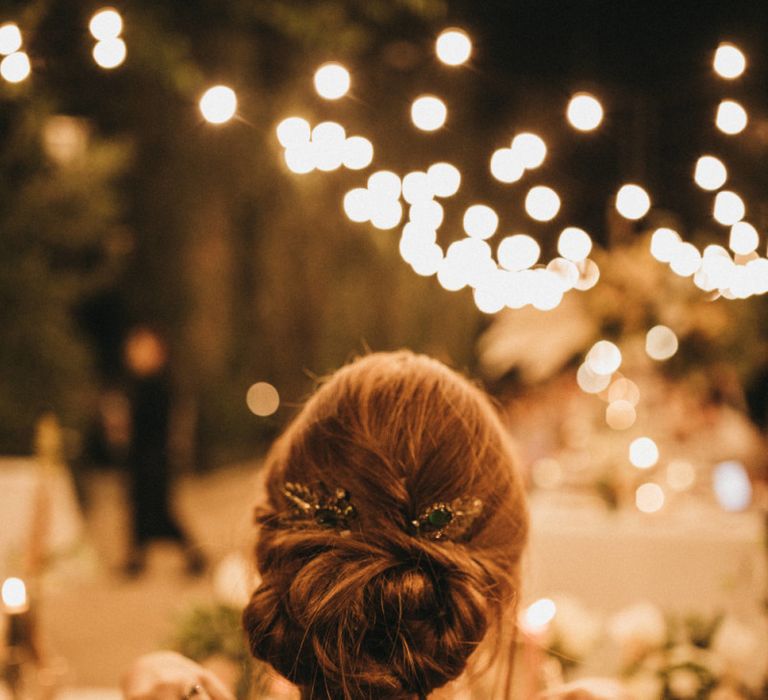 Pinned wedding hair secured with hair comb