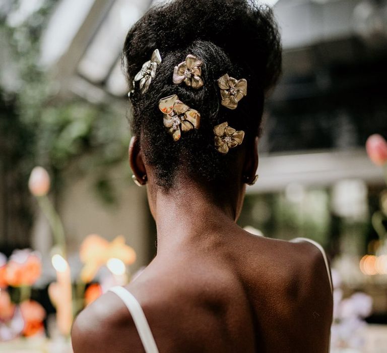 Black bride with Tilly Thomas Lux hair pieces pinned in her hair