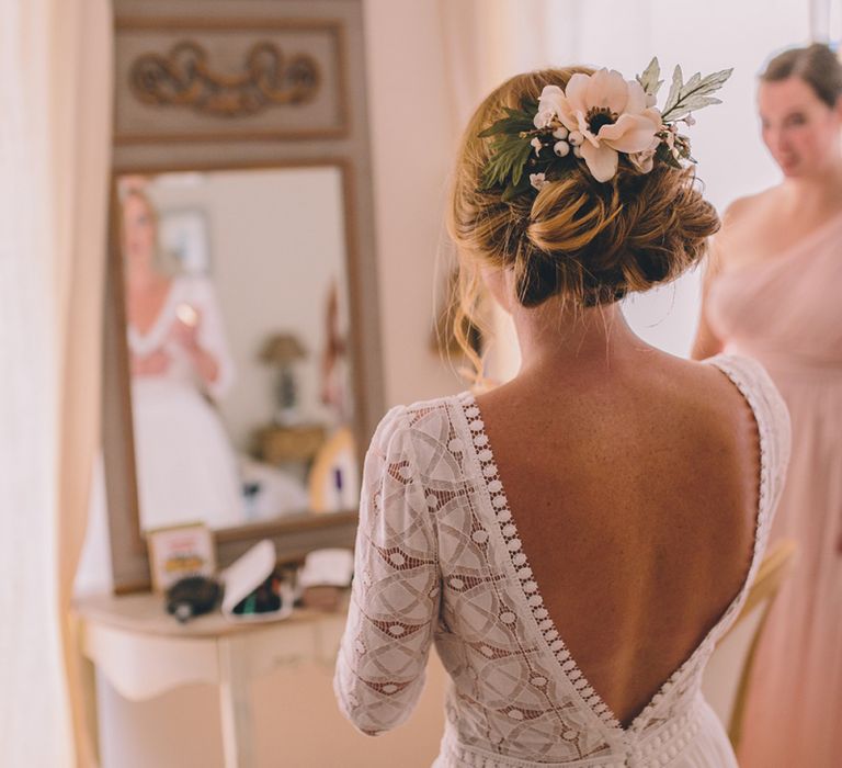 Wedding morning bridal preparations with bride wearing flowers in her hair