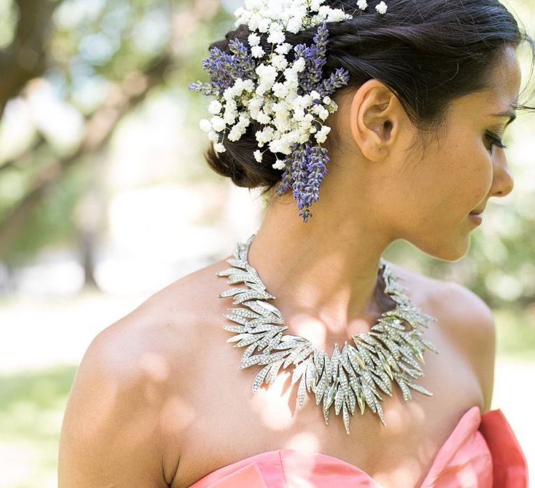 Bride with side bun and training flowers