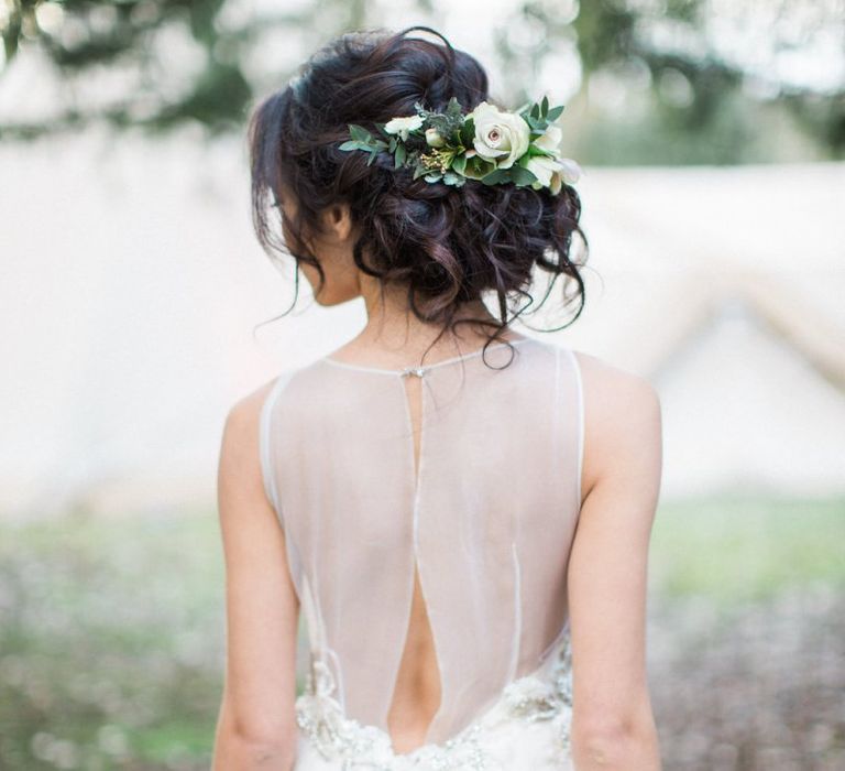 Loosely pinned wedding hair with fresh flowers