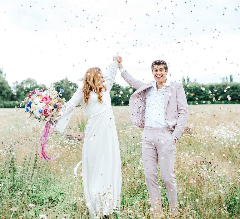 Confetti moment in a summer meadow