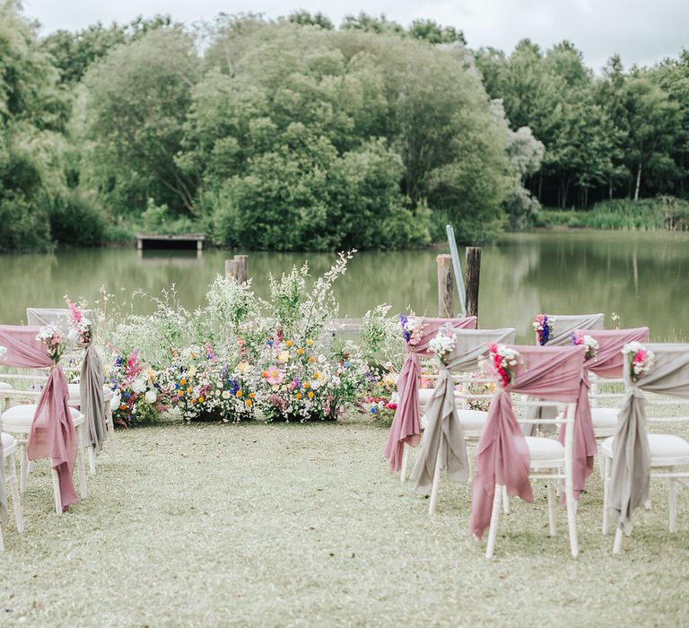 Outdoor wedding ceremony - wedding ideas for summer with colourful wild flowers