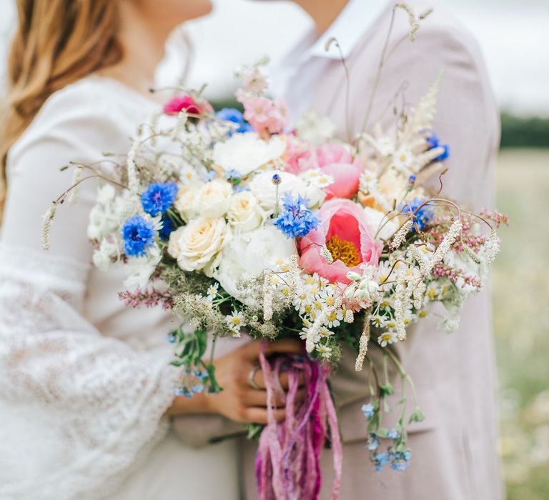 Colourful wedding bouquet tied with pink ribbon - wedding ideas for summer