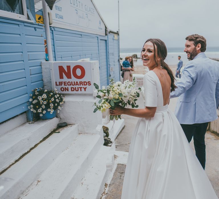 Bride With Pony Tail // Lusty Glaze Beach Wedding // Image By Ross Talling Photography