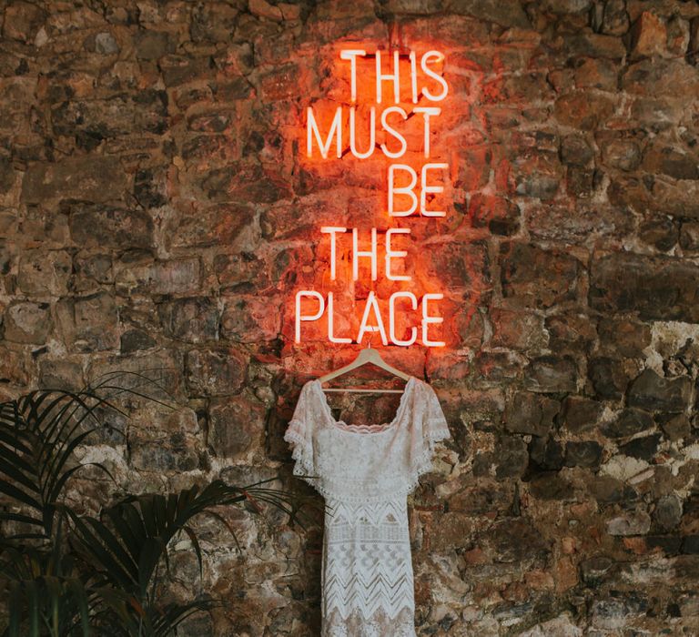 This Must Be The Place Neon Sign and Lace Wedding Dress