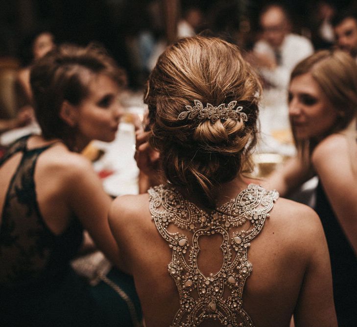 Bride with Beaded Racer Back Wedding Dress and Chic Bridal Hairstyle