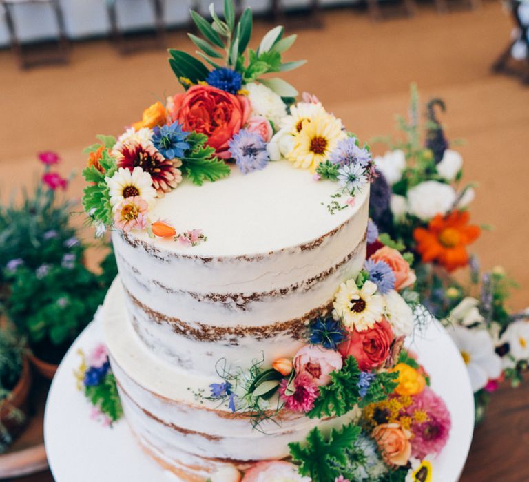 Semi Naked Wedding Cake with Bright Flowers Wedding Decor