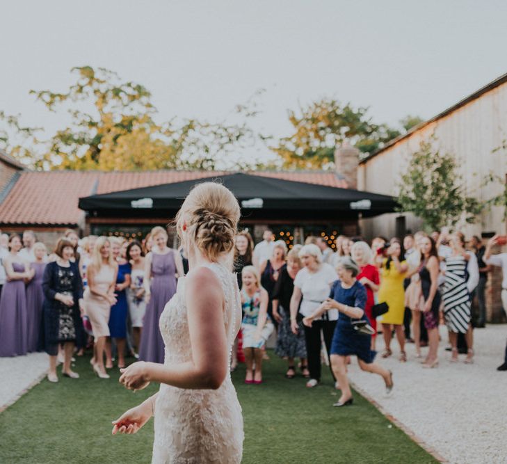 Bride Throwing her Bouquet