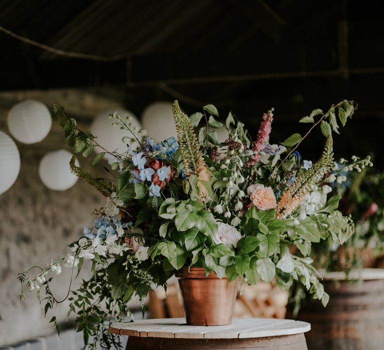 Potted Plant with Pastel Flowers and Hanging Paper Lanterns