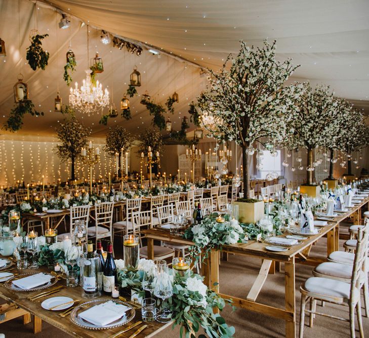 Gold and Green Wedding Reception with Fairylights and Tree Wedding Decor