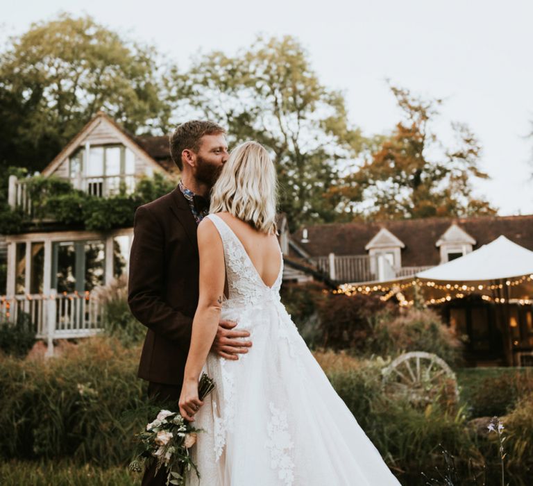 Bride and Groom Embracing at Their Exclusive Use Wedding Venue